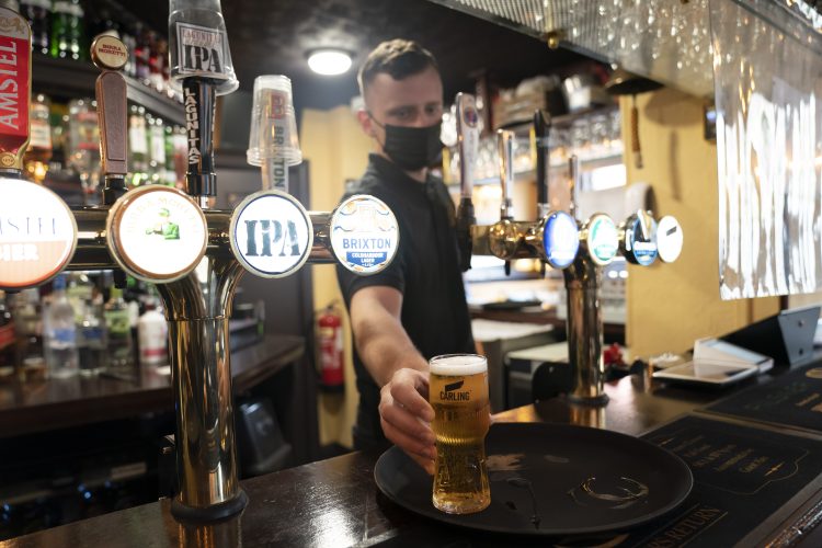 Joy for UK pubs and hugs  tempered by rise in virus variant